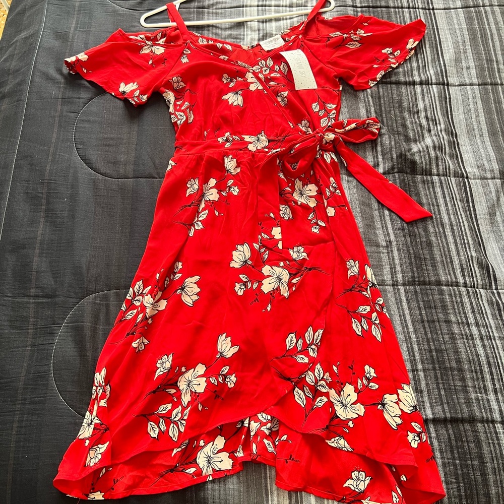 Red color and flowers. suit reaches knees